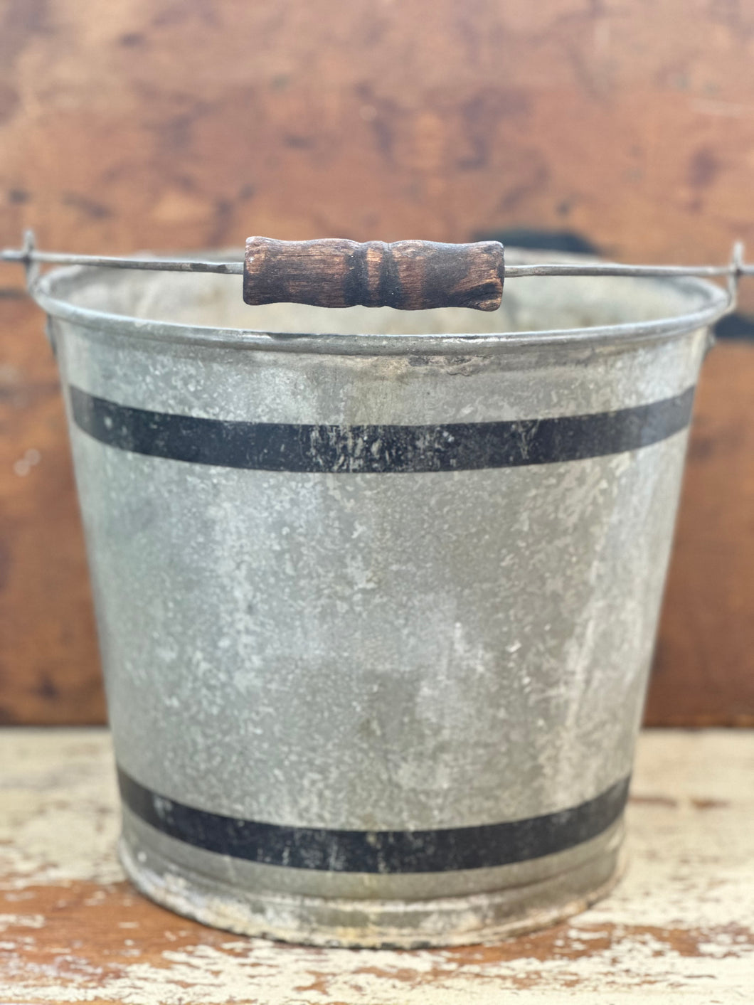 lovely galvanized bucket with black stripes and wood handle